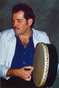 Mance playing bodhran