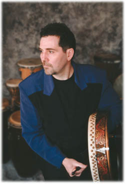 Mance playing bodhran